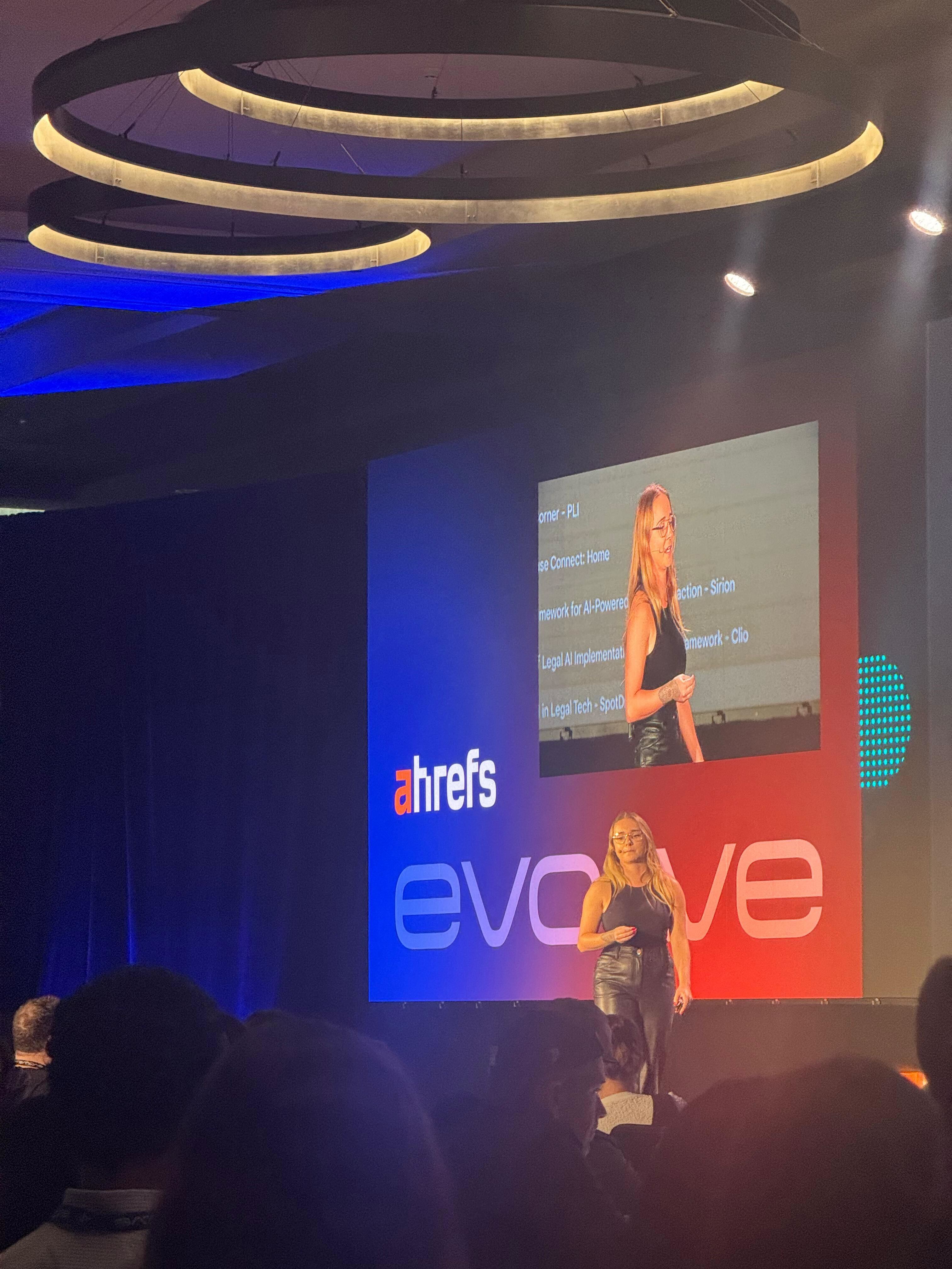 Sophie Brannon presenting on stage at Ahrefs Evolve conference