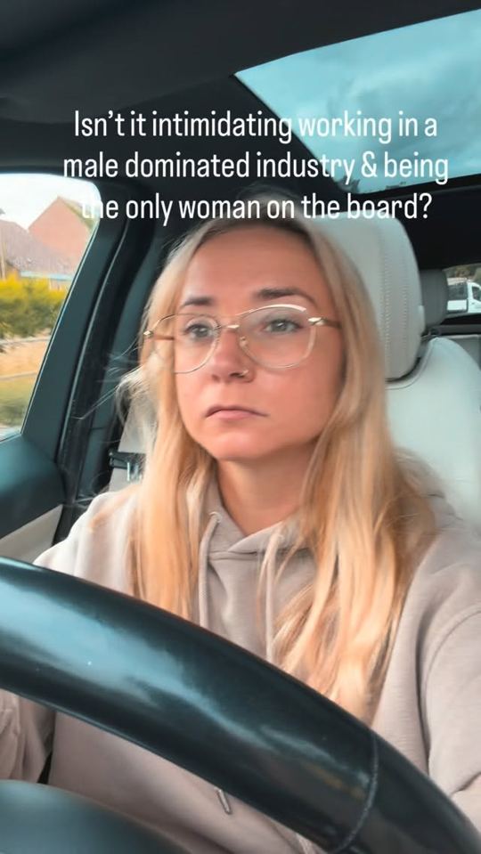Sophie driving, with on-screen text: Isn't it intimidating working in a male dominated industry and being the only woman on the board?